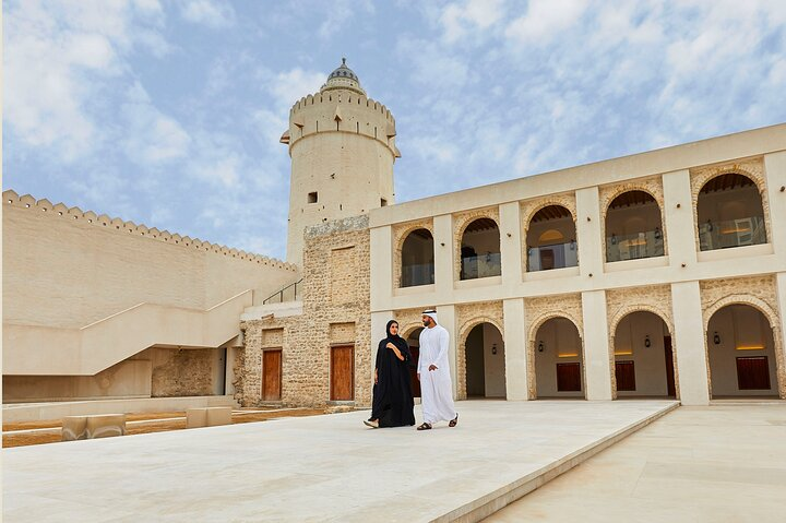 Explore the rich history of Abu Dhabi at Qasr Al Hosn where ancient architecture meets the stories of the Baniyas tribe inviting travelers to connect with the city's heritage.